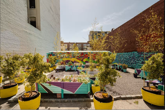 A colorful parklet between two buildings