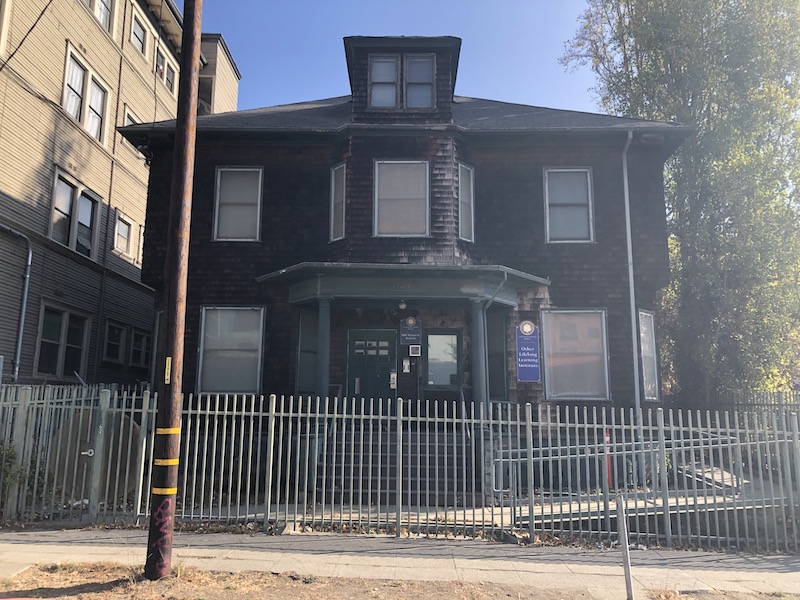 Weary brown-shingled Berkeley house